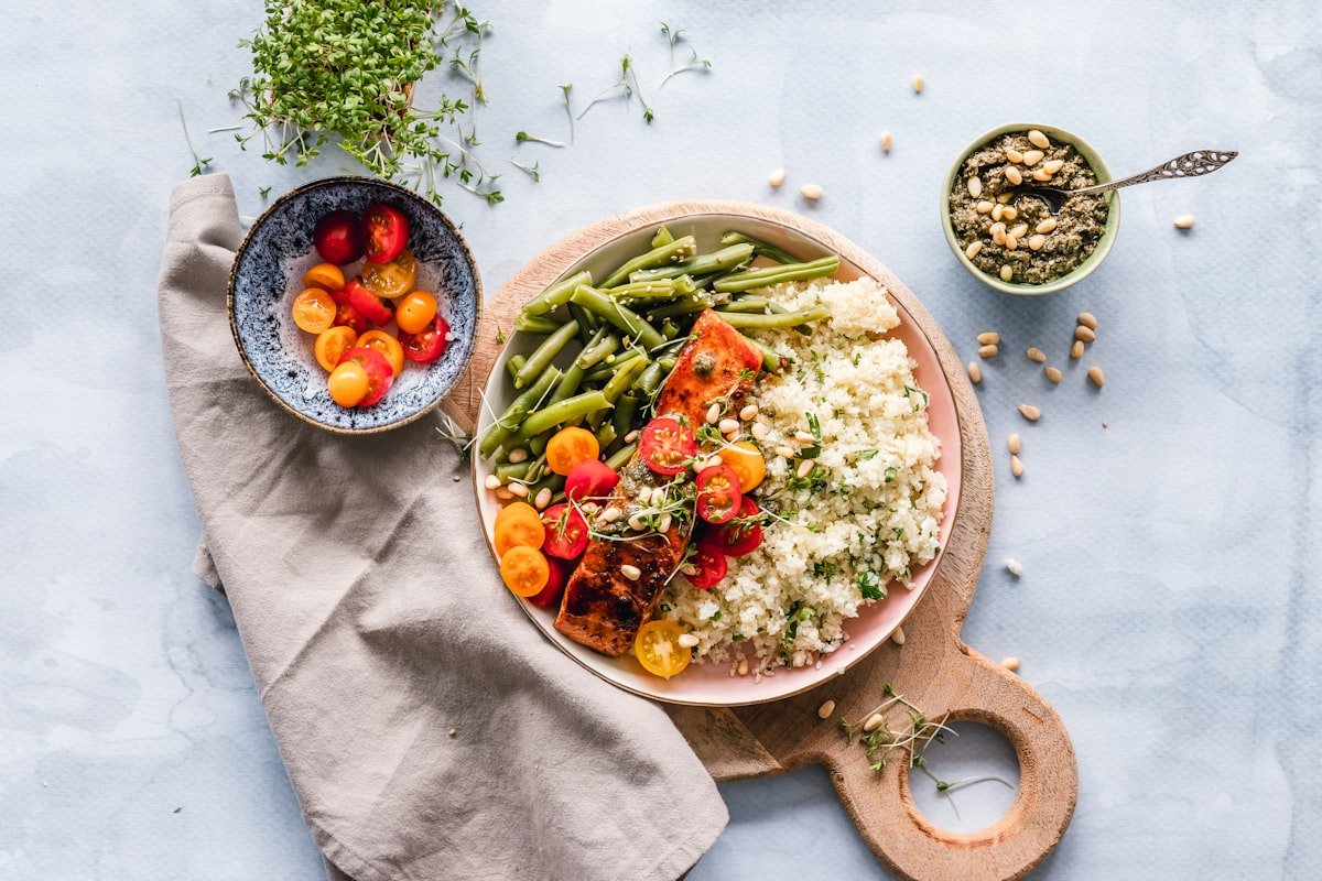 High protein plate of salmon, quinoa and vegetables to support muscle recovery